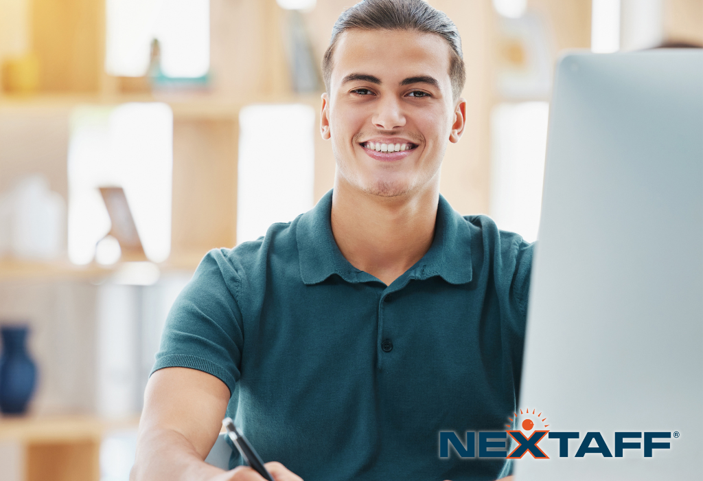 Young man in job training sitting at a computer